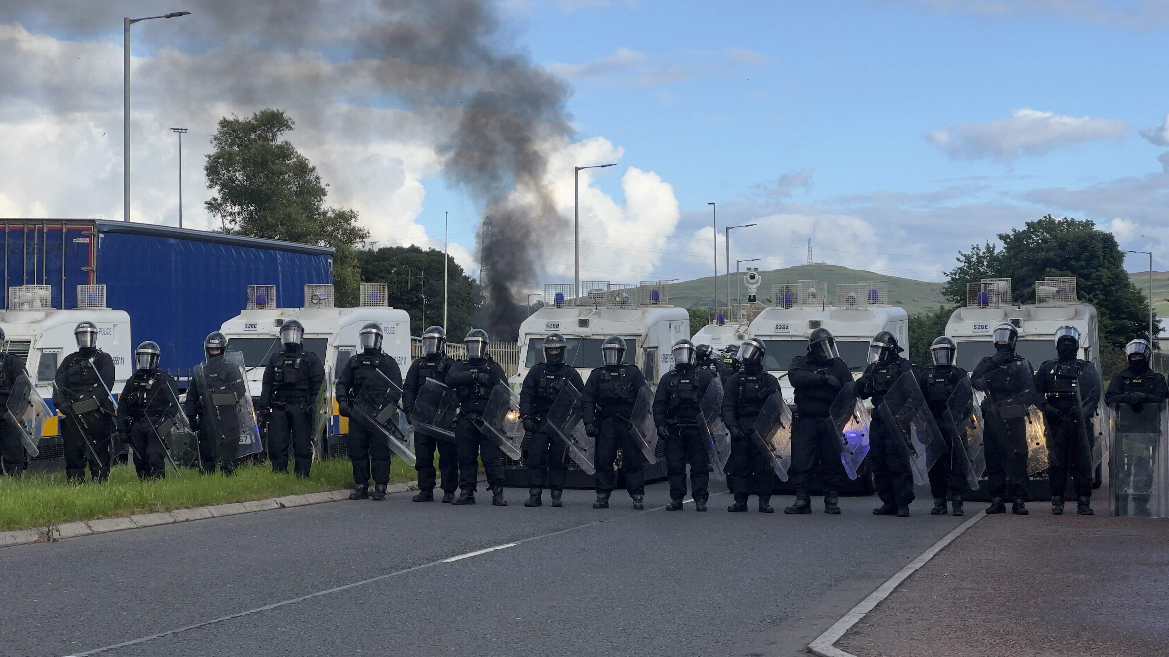 Belfast riots: Water cannon deployed and lorry set ablaze as cops come under fire with bricks near hotel