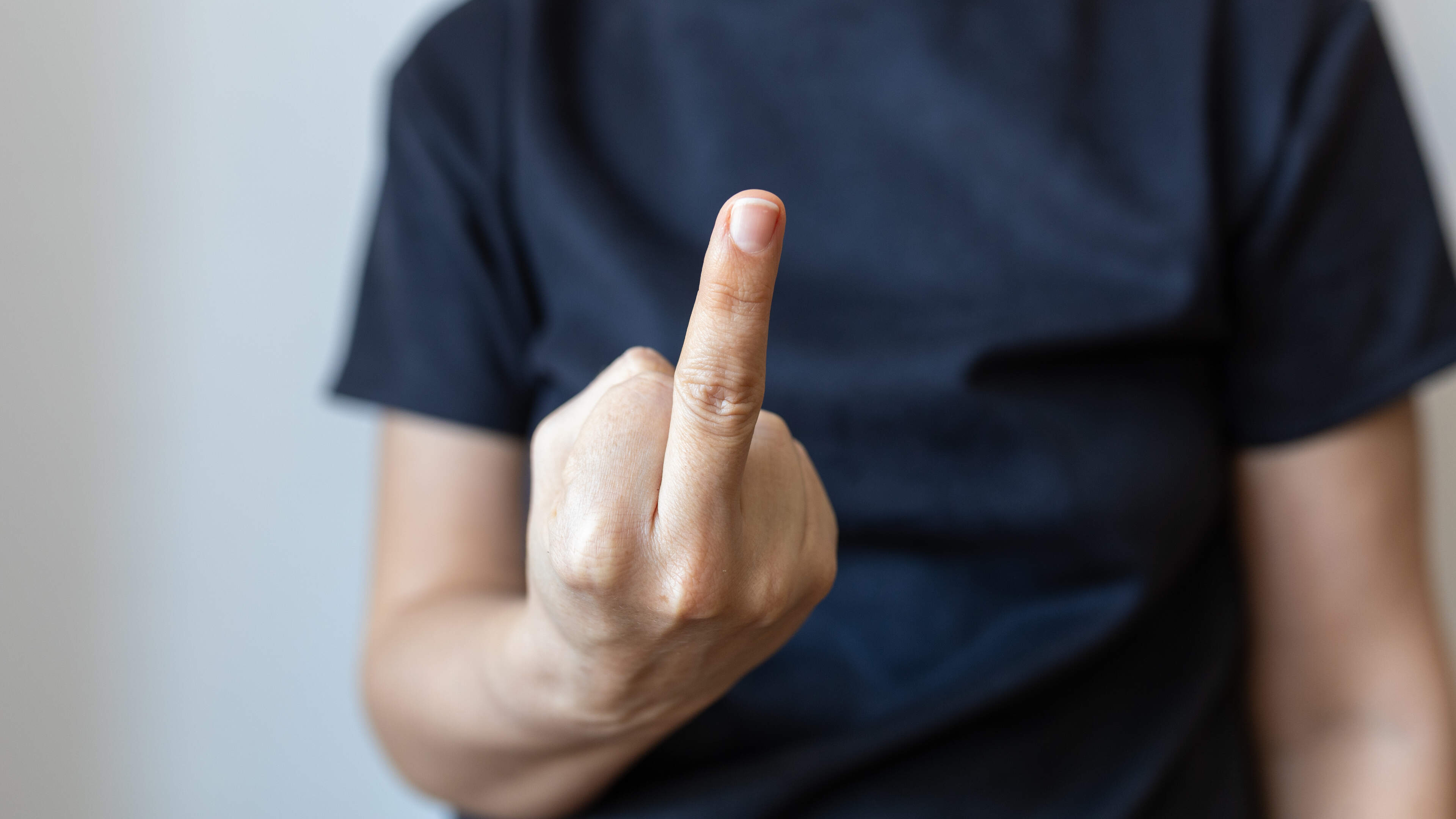 Conspiracy theorist jailed for abusive behaviour towards ex-partner gives middle finger gesture to court