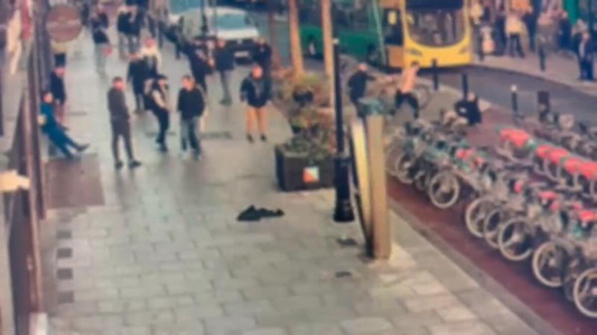 Just another average day on Dublin's Talbot Street - as bare-chested brawler throws punches and kicks