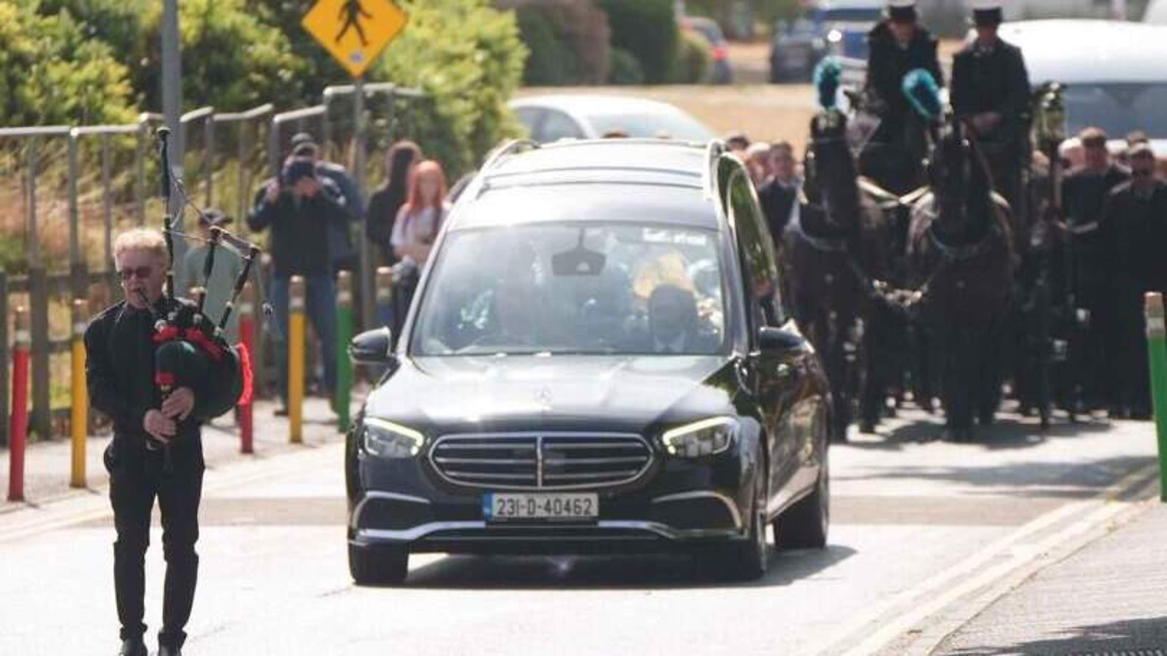 Lone piper leads horse-drawn coffin of M9 crash teen as large garda presence shadows town