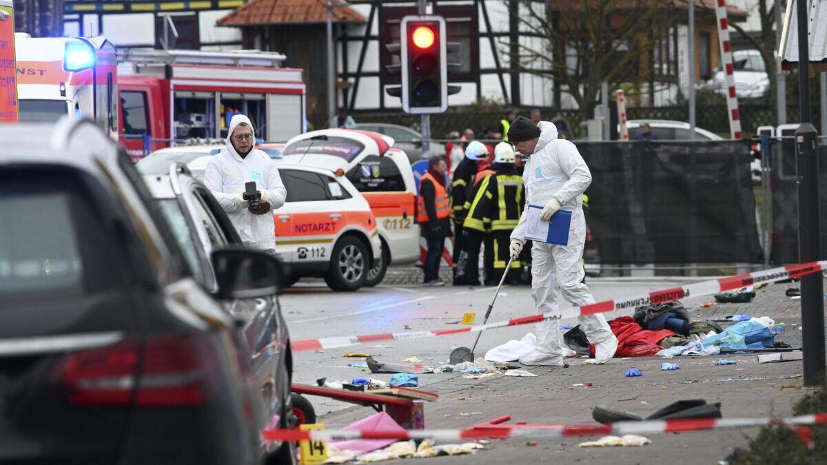 Man charged with attempted murder after car driven into crowd at ...