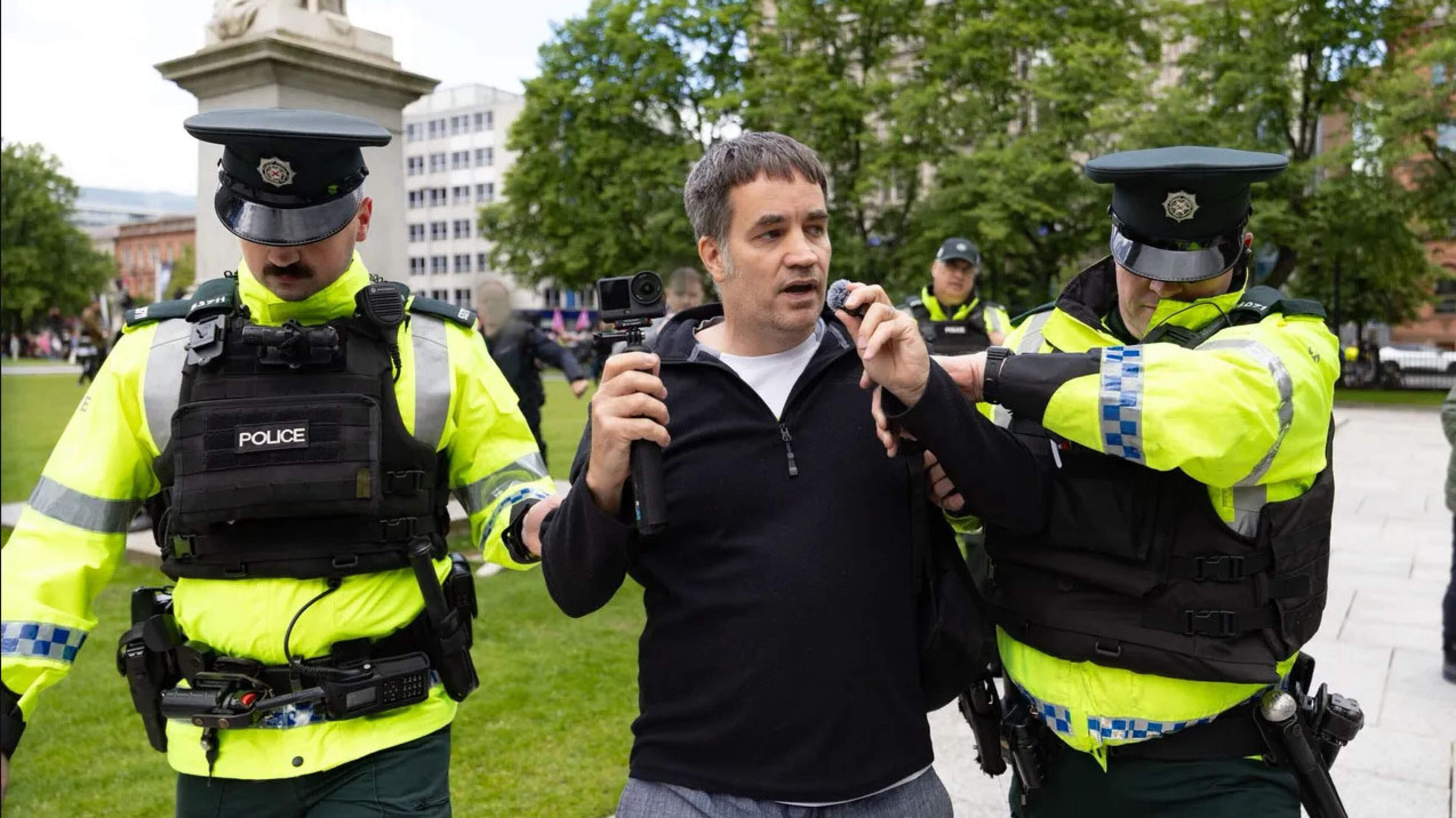 Racist thug linked to Klu Klux Klan outfit stunt marched out of Belfast rally