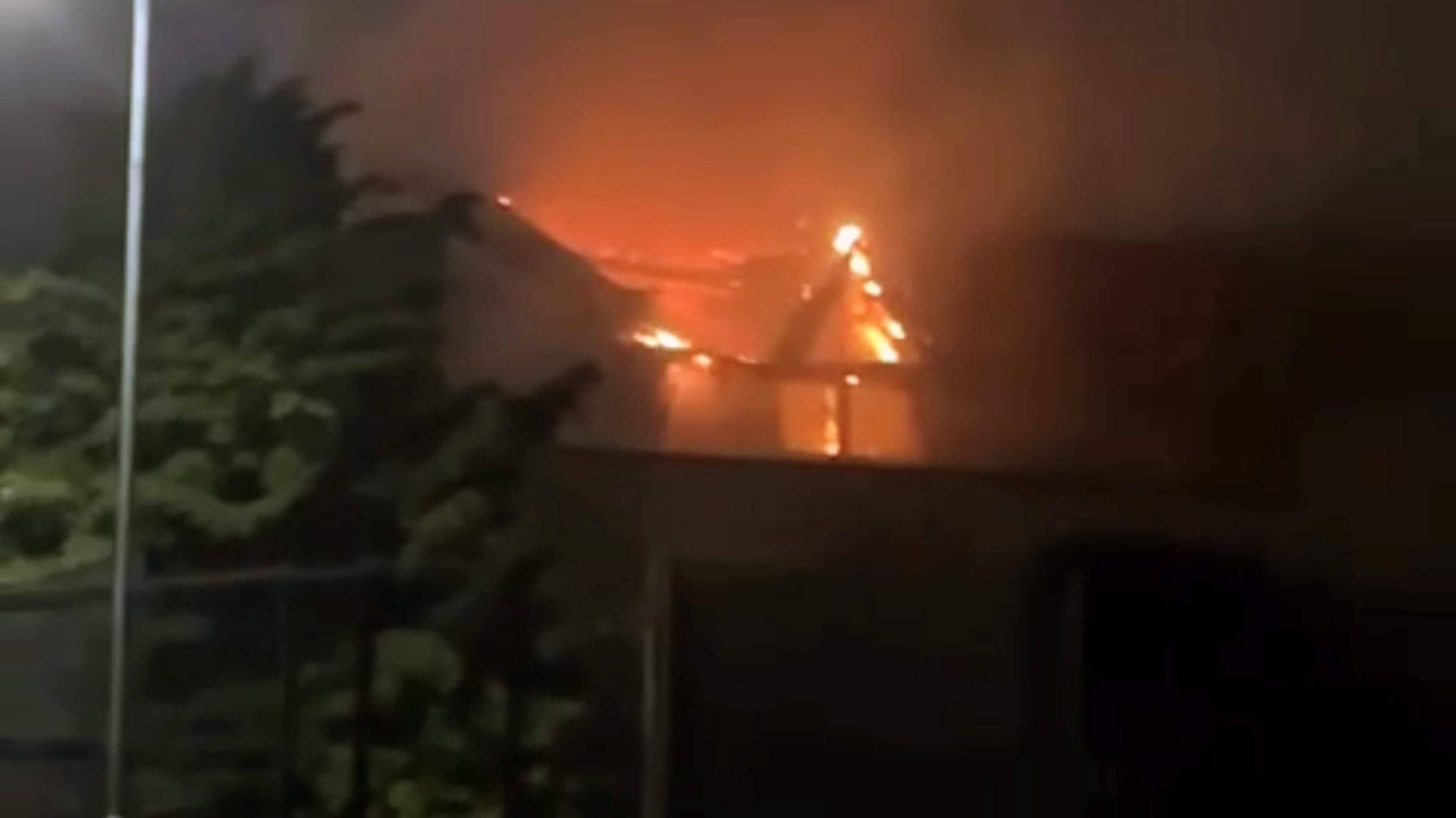 ‘Angry exchanges’ took place outside Gospel Hall set ablaze by racist thugs
