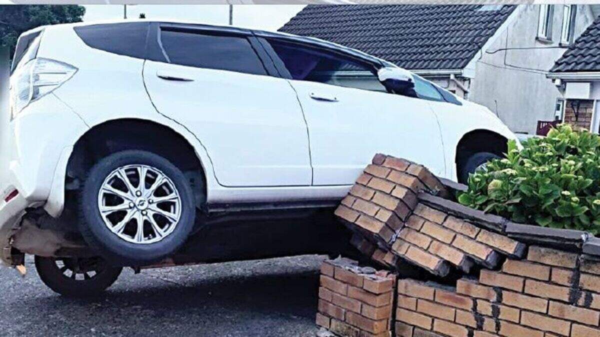 ‘Can’t park there mate’ – Family car crashes through brick wall in ...