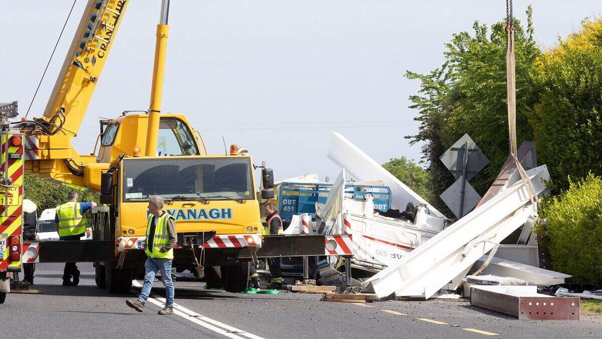 Truck driver airlifted to hospital after being trapped for over two ...