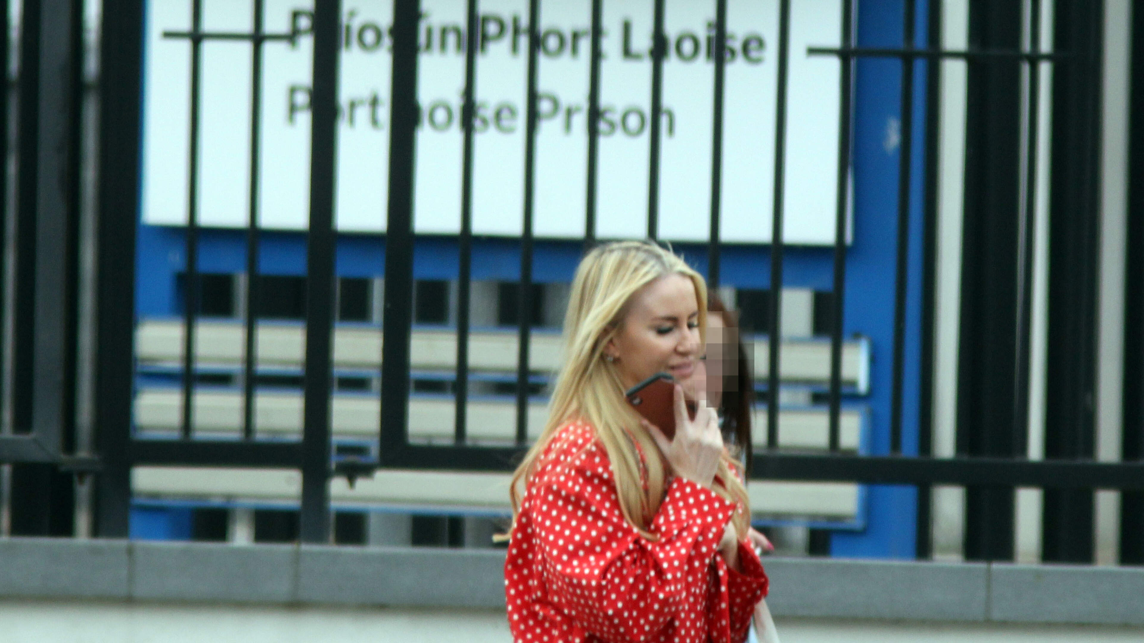 Anita Freeman is moll in red as she visits partner Sean McGovern in Portlaoise Prison 