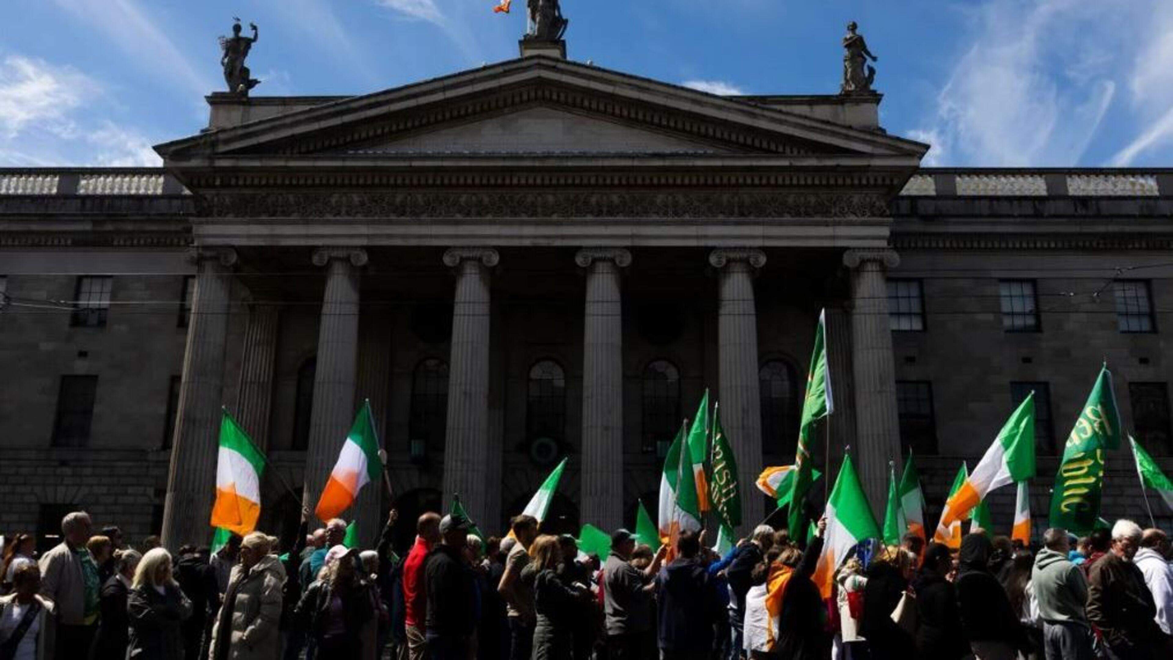 Dublin anti-immigration protesters march from O’Connell Street towards the Dáil in response to Belfast attack