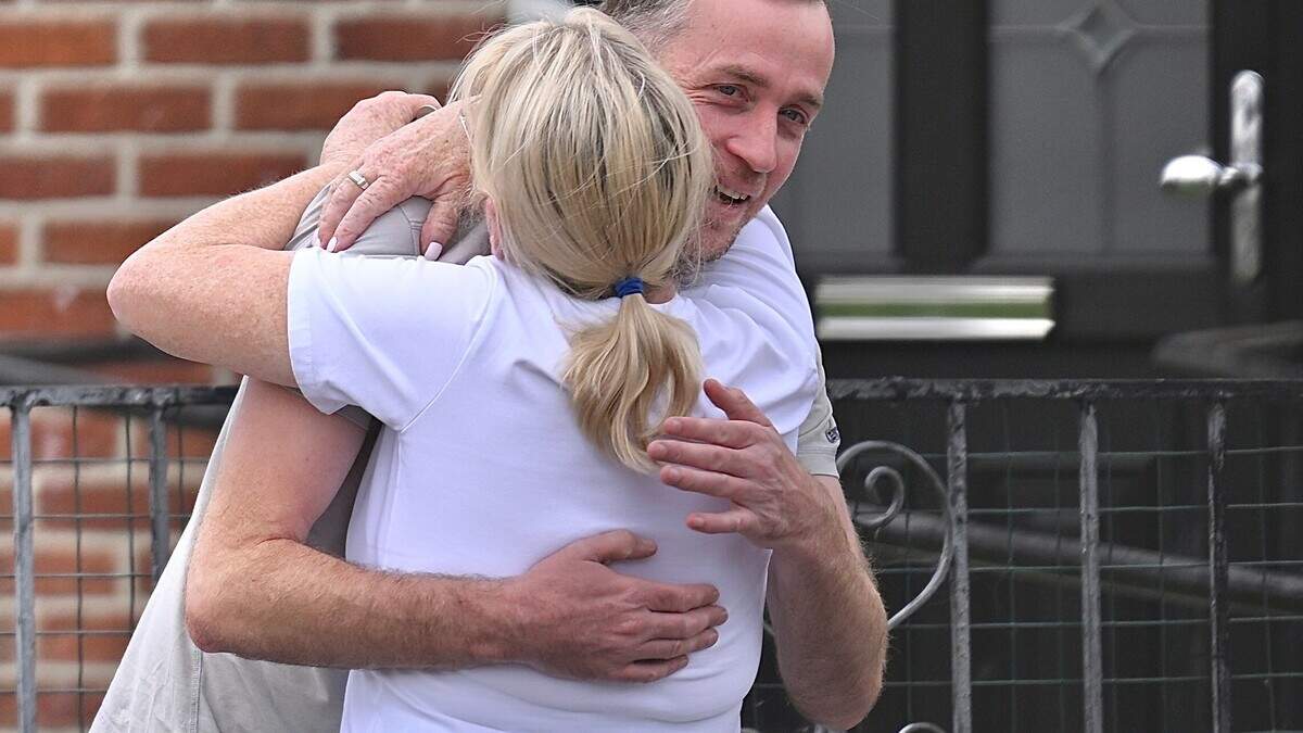 Museum worker accused of Semtex plot is welcomed home with open arms after getting bail