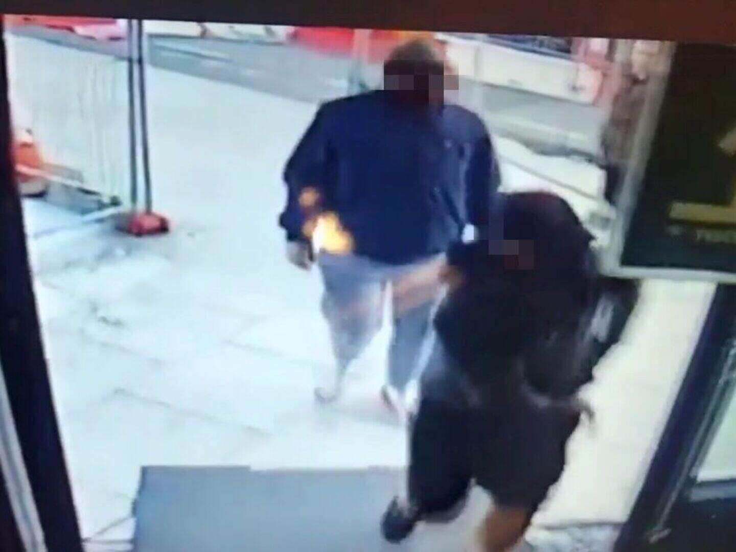 Woman arrested after three men armed with hammers steal cash from ...