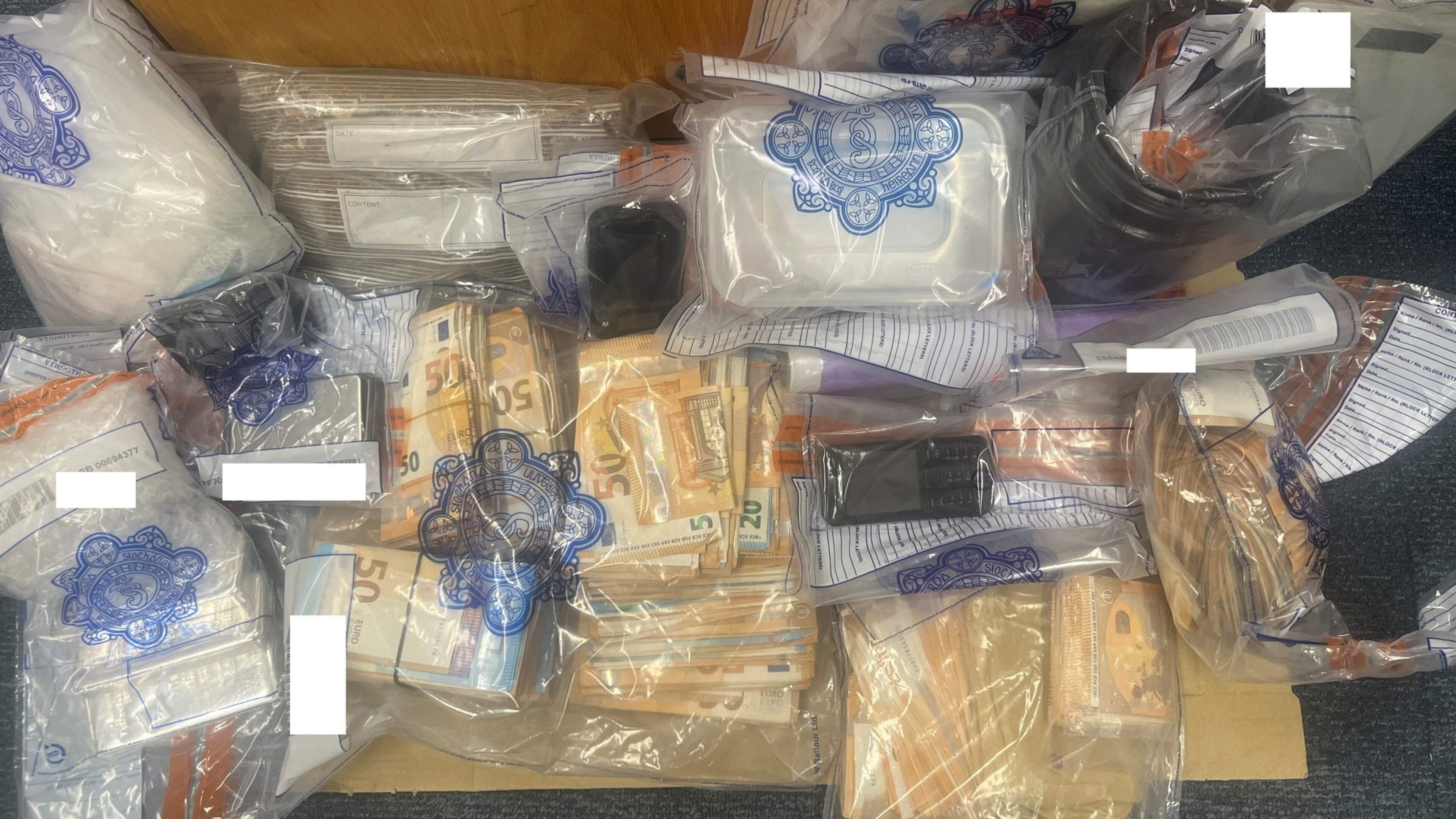 Gardaí seize three silver bars worth €7,500, cash and drugs during house search in Louth