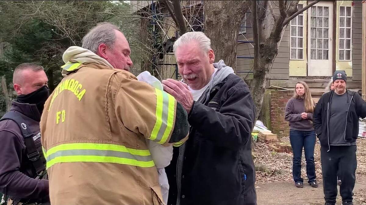 Touching moment dog revived after house fire is reunited with owner ...