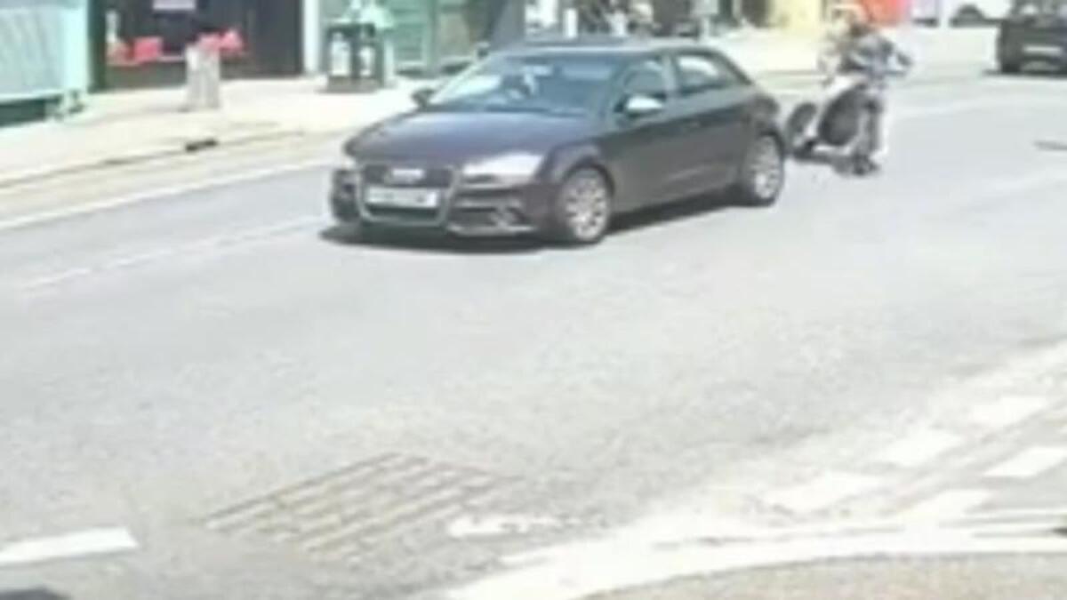 Watch as e-scrambler rider smashes into car during rush hour traffic