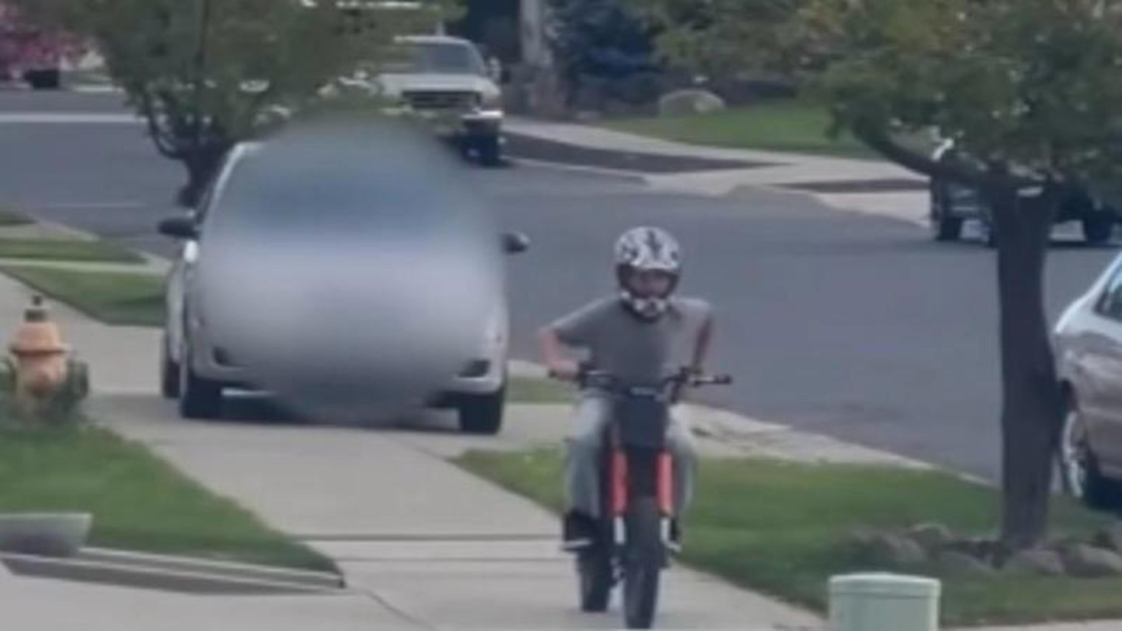 Woman arrested after scary moment she drove onto path to hit child on bike