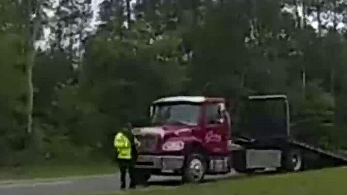 Footage shows a driver launching their car off of a parked tow truck ...