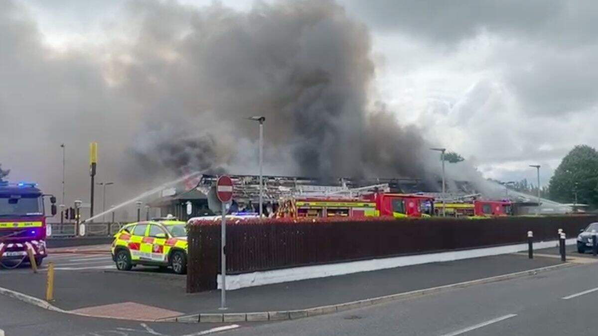Fire crews battle massive fire at McDonalds after car bursts into ...