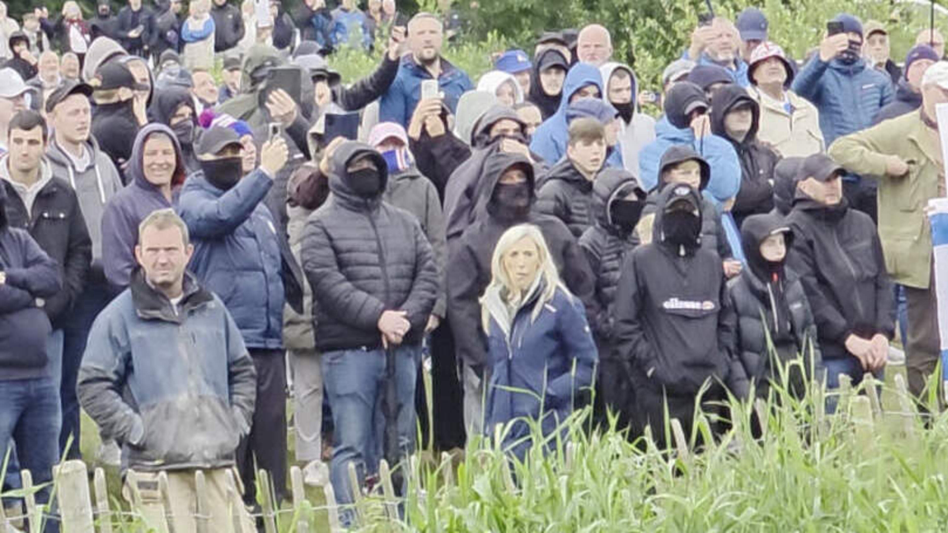 DUP MP defends being pictured with masked men at counter-protest following criticism