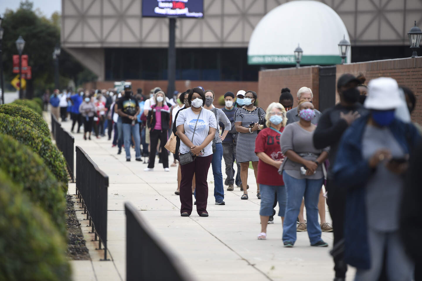 Swing state Georgia breaks turnout record on first day of early voting ...