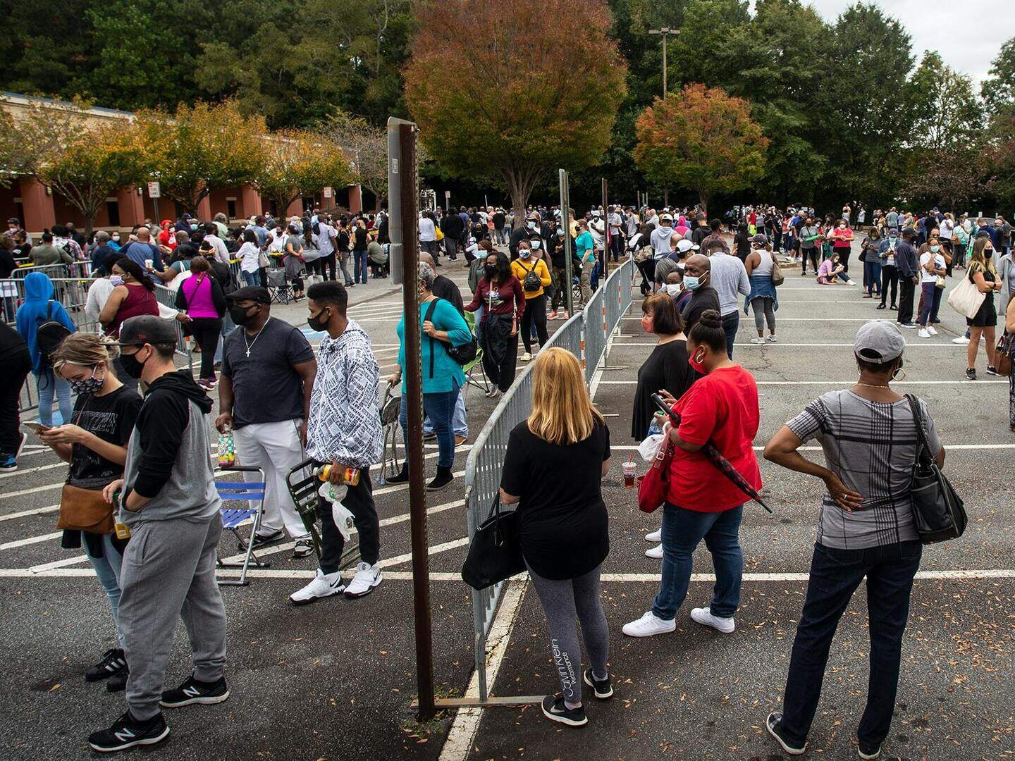 Swing state Georgia breaks turnout record on first day of early voting ...
