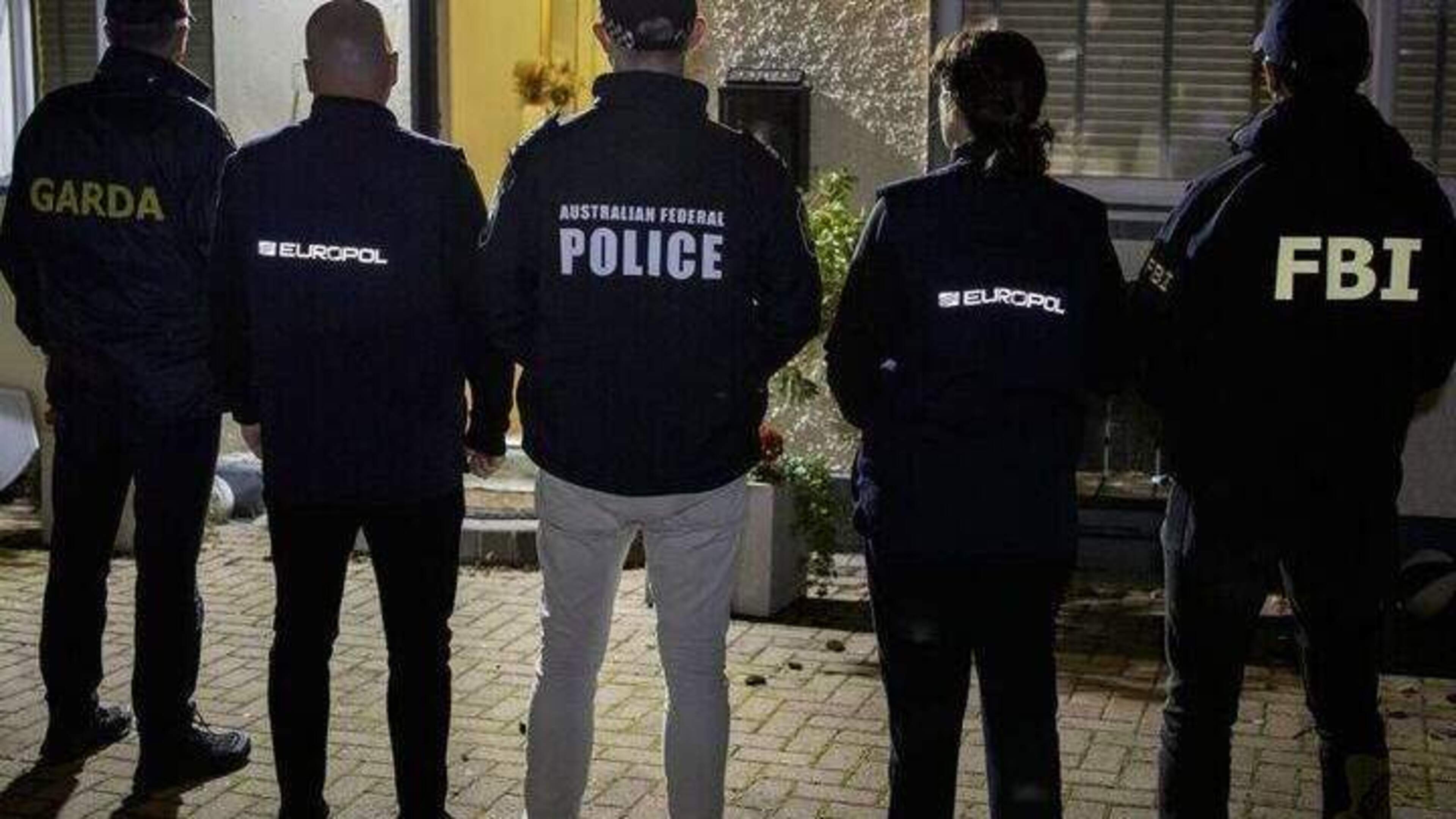 Two men charged with organised crime and drug offences linked to hack of Ghost network